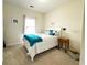 Comfortable bedroom with queen-sized bed, side table, and bright natural light at 224 Castle Dr. # 1408, Myrtle Beach, SC 29579