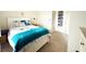 Bright bedroom with comfortable bedding, plush carpet, and closet organizer for efficient storage at 224 Castle Dr. # 1408, Myrtle Beach, SC 29579