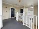 Hallway with black doors leading to units and stairs, along with a clearly marked exit sign overhead at 224 Castle Dr. # 1408, Myrtle Beach, SC 29579