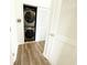 Laundry closet with stackable washer and dryer and white louvered door at 224 Castle Dr. # 1408, Myrtle Beach, SC 29579