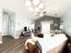 Inviting living room with vaulted ceilings, ceiling fan, and wood laminate flooring at 224 Castle Dr. # 1408, Myrtle Beach, SC 29579