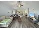 Inviting living room with hardwood flooring, a vaulted ceiling, and an open view into the kitchen at 224 Castle Dr. # 1408, Myrtle Beach, SC 29579