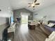 Cozy living room with hardwood flooring, vaulted ceiling and a sliding glass door to a deck at 224 Castle Dr. # 1408, Myrtle Beach, SC 29579