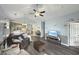 Well-lit living room with hardwood flooring, vaulted ceiling, and an open layout to the kitchen area at 224 Castle Dr. # 1408, Myrtle Beach, SC 29579