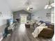 Inviting living room featuring vaulted ceiling, hardwood floors, and sliding glass doors to outdoor patio at 224 Castle Dr. # 1408, Myrtle Beach, SC 29579