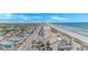 Aerial view displaying the neighborhood and a long sandy beach with ocean in the background at 2301 S Ocean Blvd. # 1202, North Myrtle Beach, SC 29582