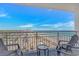 Relaxing balcony featuring seating, a table, and stunning ocean views perfect for enjoying the outdoors at 2301 S Ocean Blvd. # 1202, North Myrtle Beach, SC 29582