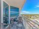 Spacious balcony with ample seating and panoramic ocean views, creating an ideal space for relaxation and enjoyment at 2301 S Ocean Blvd. # 1202, North Myrtle Beach, SC 29582