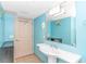Well-lit bathroom with a pedestal sink, large mirror, and storage, offering practicality and comfort at 2301 S Ocean Blvd. # 1202, North Myrtle Beach, SC 29582