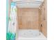 Relaxing bathtub and shower with decorative shower curtain, offering a serene bathing experience at 2301 S Ocean Blvd. # 1202, North Myrtle Beach, SC 29582