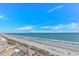 Great beach views from this building showcasing sand, ocean, and neighborhood in distance at 2301 S Ocean Blvd. # 1202, North Myrtle Beach, SC 29582