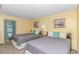 Inviting bedroom featuring two beds, tasteful decor, and a view into the ensuite bathroom at 2301 S Ocean Blvd. # 1202, North Myrtle Beach, SC 29582