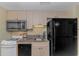 Efficient kitchen featuring essential appliances, granite countertops, and ample cabinet space for convenient cooking at 2301 S Ocean Blvd. # 1202, North Myrtle Beach, SC 29582
