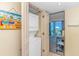 Convenient in-unit laundry closet with stacked washer/dryer next to an ocean view at 2301 S Ocean Blvd. # 1202, North Myrtle Beach, SC 29582