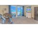 Comfortable living room with balcony access, providing natural light and scenic views for a relaxing atmosphere at 2301 S Ocean Blvd. # 1202, North Myrtle Beach, SC 29582