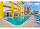 Resort-style outdoor pool with ample lounge chairs, umbrellas, and vibrant surroundings at 2301 S Ocean Blvd. # 1202, North Myrtle Beach, SC 29582