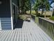 View of the deck, featuring wood railing, composite deck, and outdoor furniture set at 2333 Brick Dr., Longs, SC 29568