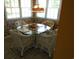 Cozy breakfast nook with a glass table, wicker chairs, and natural light from surrounding windows at 2333 Brick Dr., Longs, SC 29568