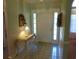 Entryway boasting tile floors, elegant table with lamp, and a welcoming front door with sidelights at 2333 Brick Dr., Longs, SC 29568