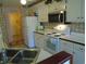 Kitchen with white appliances, ample counter space, and a convenient layout at 2333 Brick Dr., Longs, SC 29568