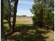 Scenic view of a pond surrounded by trees and manicured lawns of neighborhood homes at 2333 Brick Dr., Longs, SC 29568