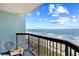 Balcony offers stunning beach views and a serene retreat with a comfortable chair and ocean breeze at 2401 S Ocean Blvd. # 752, Myrtle Beach, SC 29577