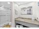 Bathroom featuring a granite countertop, walk-in shower, and ample lighting at 2401 S Ocean Blvd. # 752, Myrtle Beach, SC 29577