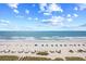 Expansive beach view featuring blue umbrellas, white sand, and clear ocean, perfect for a getaway at 2401 S Ocean Blvd. # 752, Myrtle Beach, SC 29577