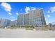 Luxury condo building with balconies overlooking the beach, providing stunning oceanfront views at 2401 S Ocean Blvd. # 752, Myrtle Beach, SC 29577