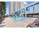 Fun splash park with playful water features, seating, and palm trees for shade on a sunny day at 2401 S Ocean Blvd. # 752, Myrtle Beach, SC 29577
