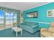 Cozy living room featuring a sofa, coffee table, and balcony access at 2801 S Ocean Blvd. # 339, North Myrtle Beach, SC 29582