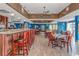 Restaurant with wood floors, tables, chairs, and a full bar area at 2801 S Ocean Blvd. # 339, North Myrtle Beach, SC 29582