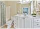 Bathroom showcasing a white vanity, toilet, a shower/tub, and neutral colored tile at 2808 N Ocean Blvd., North Myrtle Beach, SC 29582