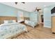 A bedroom showcasing two beds, ceiling fan, hardwood floors, and great natural light at 2808 N Ocean Blvd., North Myrtle Beach, SC 29582