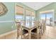 Bright dining room with a large table, seating for ten, and a view of the ocean at 2808 N Ocean Blvd., North Myrtle Beach, SC 29582