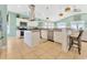 Well-equipped kitchen featuring stainless steel appliances and an island with barstool seating at 2808 N Ocean Blvd., North Myrtle Beach, SC 29582