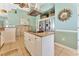 Kitchen island with range, cabinets, and stainless refrigerators at 2808 N Ocean Blvd., North Myrtle Beach, SC 29582