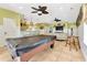 Bright, open living area with a pool table, bar seating, and stylish decor at 2808 N Ocean Blvd., North Myrtle Beach, SC 29582