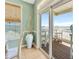 View from the dining room to the patio with the ocean in the background at 2808 N Ocean Blvd., North Myrtle Beach, SC 29582