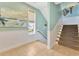 Staircase with carpeted steps, railing, light fixtures, and a window with a view at 2808 N Ocean Blvd., North Myrtle Beach, SC 29582