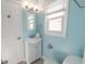 Well-lit bathroom with a white vanity, a stylish mirror, and a modern commode and fixtures at 314 45Th Ave. N, North Myrtle Beach, SC 29582