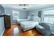 Comfortable bedroom featuring two twin beds, wood floors, and natural lighting and nice decor at 314 45Th Ave. N, North Myrtle Beach, SC 29582