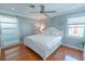Relaxing bedroom with hardwood floors, white furnishings, and natural light, with a modern fan at 314 45Th Ave. N, North Myrtle Beach, SC 29582