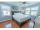 This bedroom boasts hardwood floors, coastal-themed decor, and two bright windows at 314 45Th Ave. N, North Myrtle Beach, SC 29582