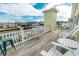 Waterfront deck featuring white Adirondack chairs and scenic water views at 314 45Th Ave. N, North Myrtle Beach, SC 29582