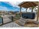 Outdoor hot tub with wooden pergola overlooking the water and scenic views at 314 45Th Ave. N, North Myrtle Beach, SC 29582