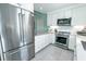Bright kitchen with stainless steel appliances and white cabinetry and plenty of storage space at 314 45Th Ave. N, North Myrtle Beach, SC 29582