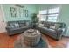 Comfortable living room featuring hardwood floors, dual sofas, and a coastal-inspired design at 314 45Th Ave. N, North Myrtle Beach, SC 29582