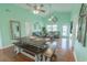 Open-concept living area with dining table, hardwood floors, and stylish coastal decor at 314 45Th Ave. N, North Myrtle Beach, SC 29582