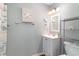 Modern bathroom with a gray vanity, a mirror, and a themed shower curtain at 3700 Golf Colony Lane # 21 B, Little River, SC 29566